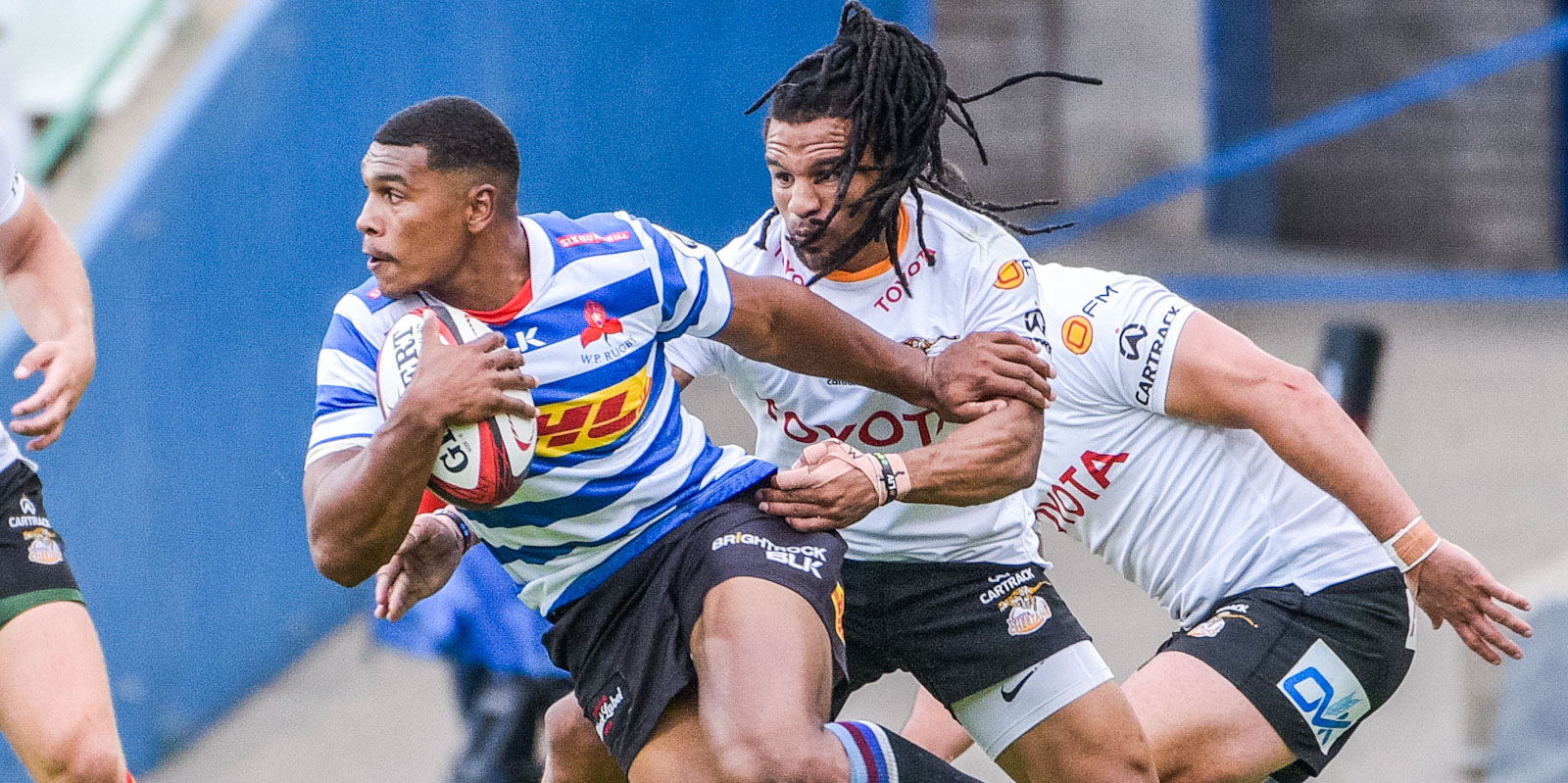 The Toyota Cheetahs' Rosco Specman stops Damian Willemse of DHL WP