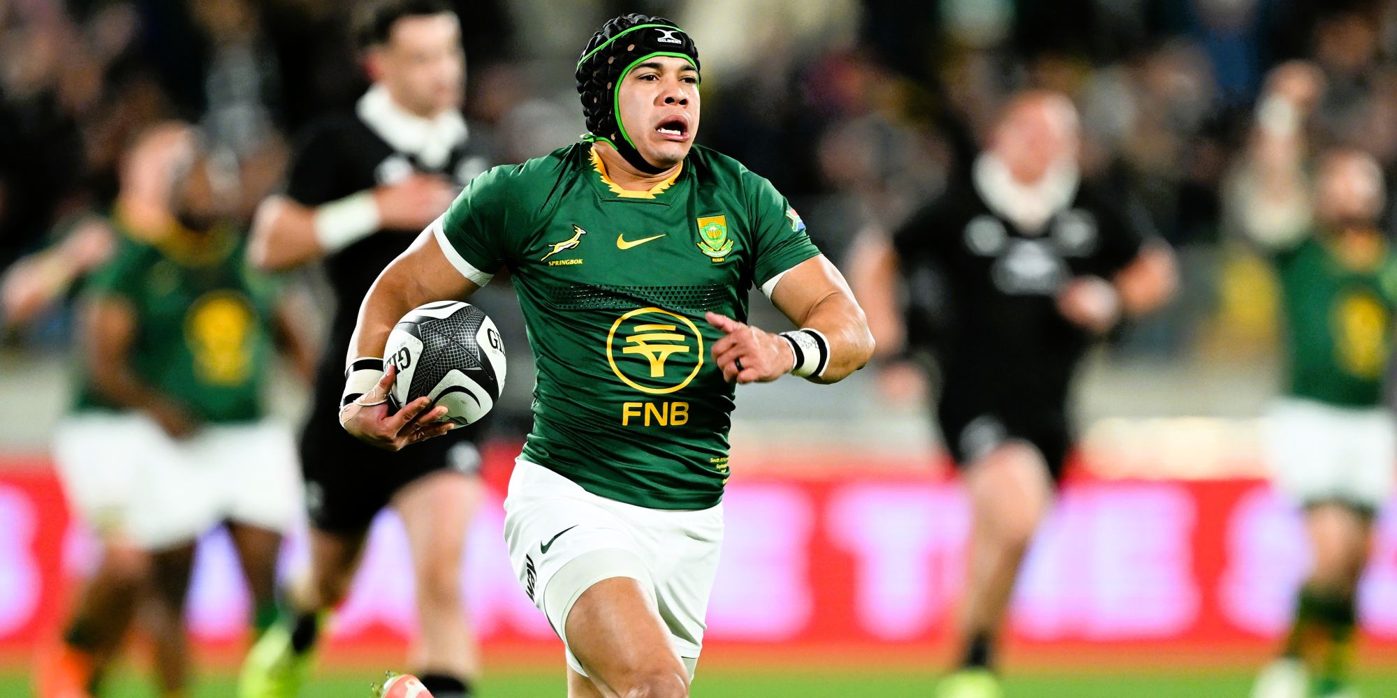 Cheslin Kolbe races away for his first try.