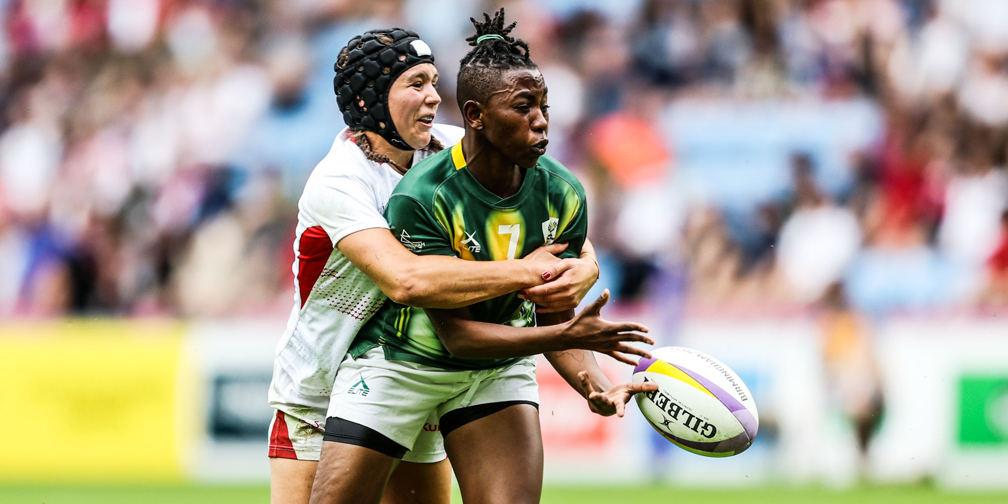 Nontuthuko Shongwe is wrapped up by an England defender in their fifth-place semi-final