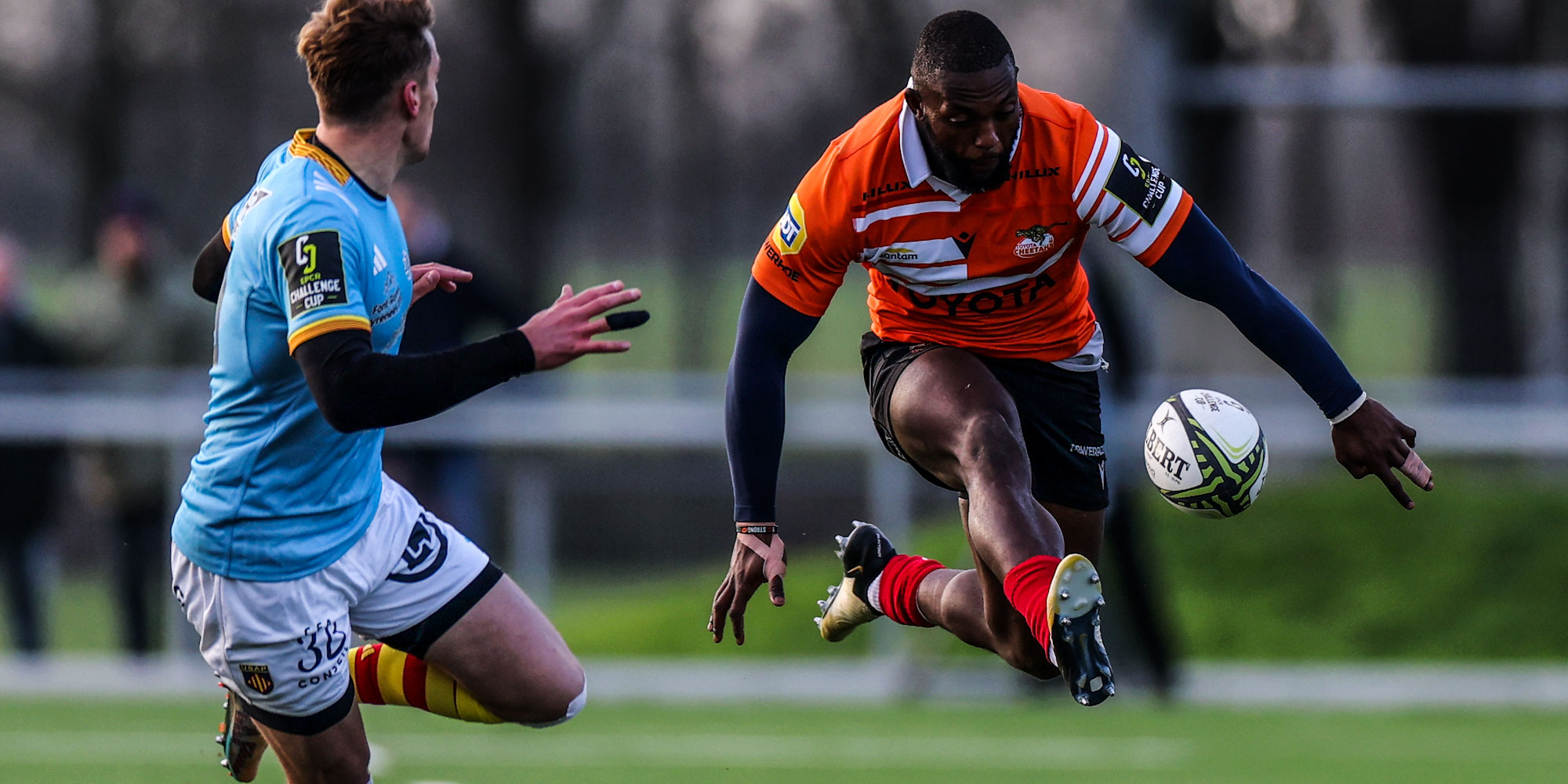 Prince Nkabinde hacks the ball ahead against Perpignan.