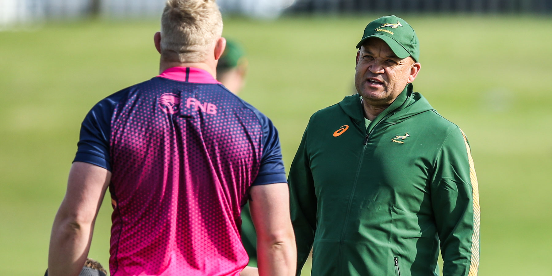 Deon Davids in conversation with Vincent Koch during a Springbok training session.